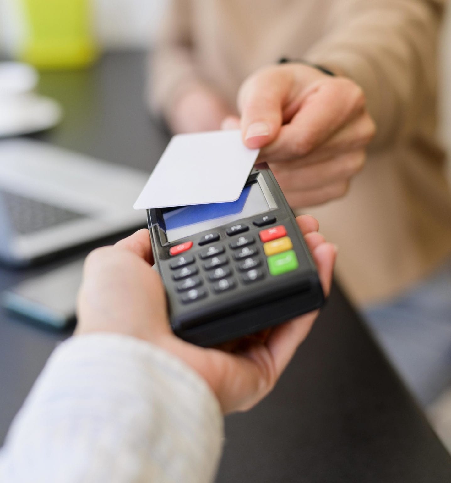 Customer paying by card at checkout